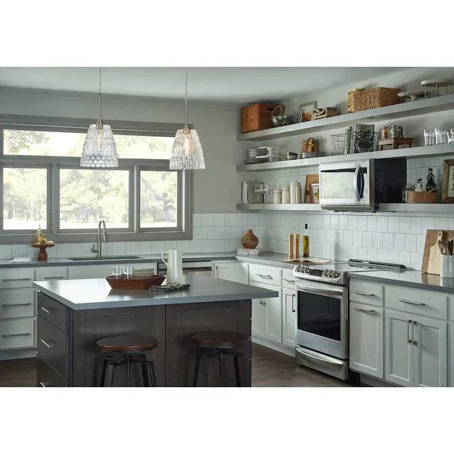 Kichler brushed nickel mini pendant lights with clear glass shades in kitchen setting.
