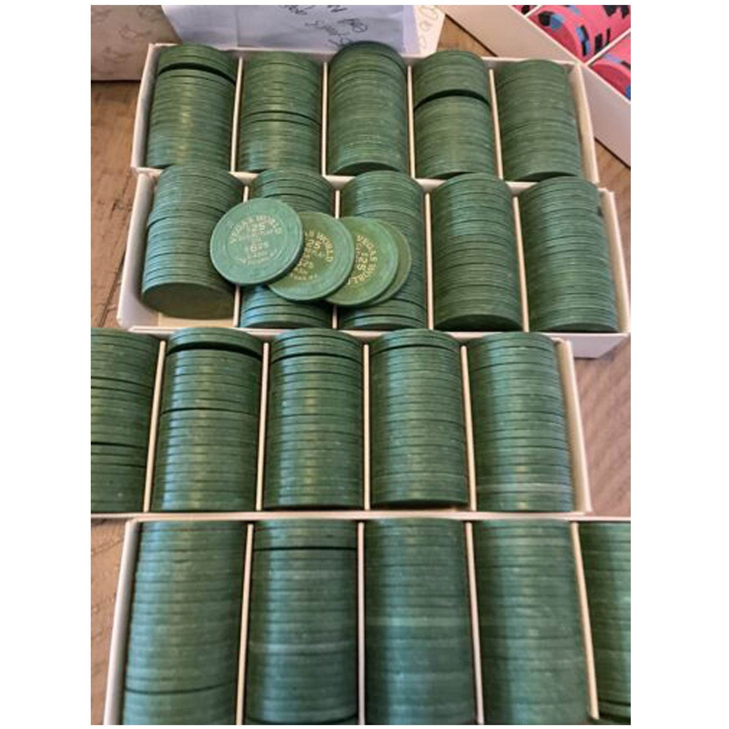 Vegas World Casino Las Vegas Nevada $25 casino play green chips displayed in boxes.