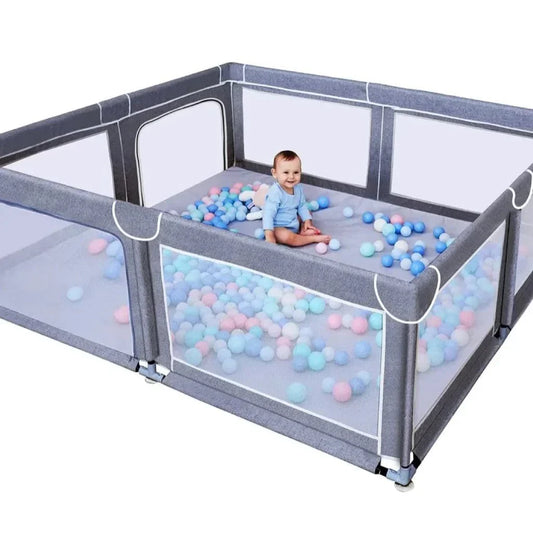 Extra-large grey TODALE baby playpen with infant and colorful balls inside.